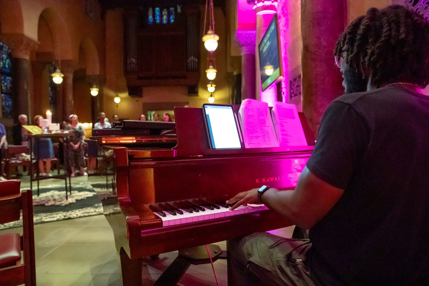 A musician at the piano leading Imagine Worship